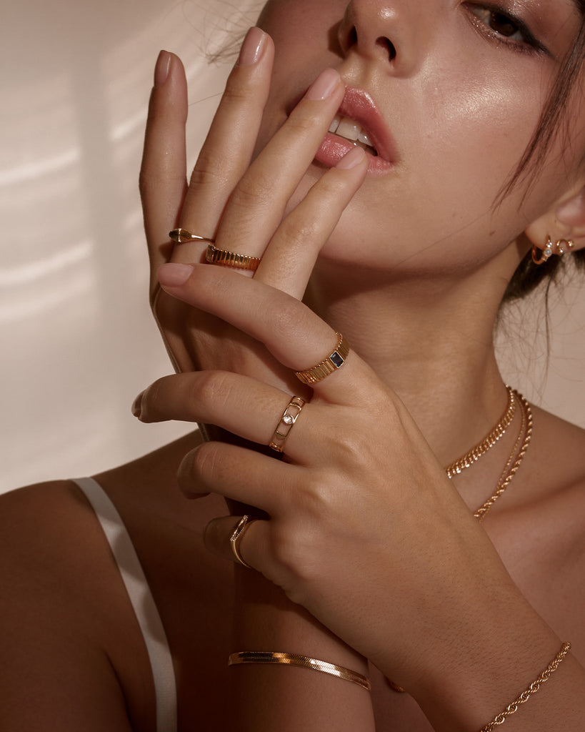 Model wearing gold-filled bracelets from Midori Jewelry Co.