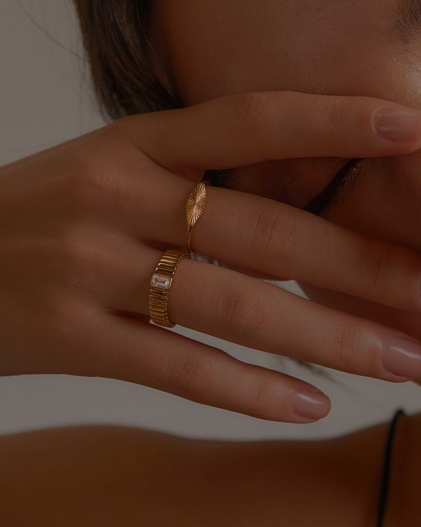 Model wearing gold-filled rings from Midori Jewelry Co.